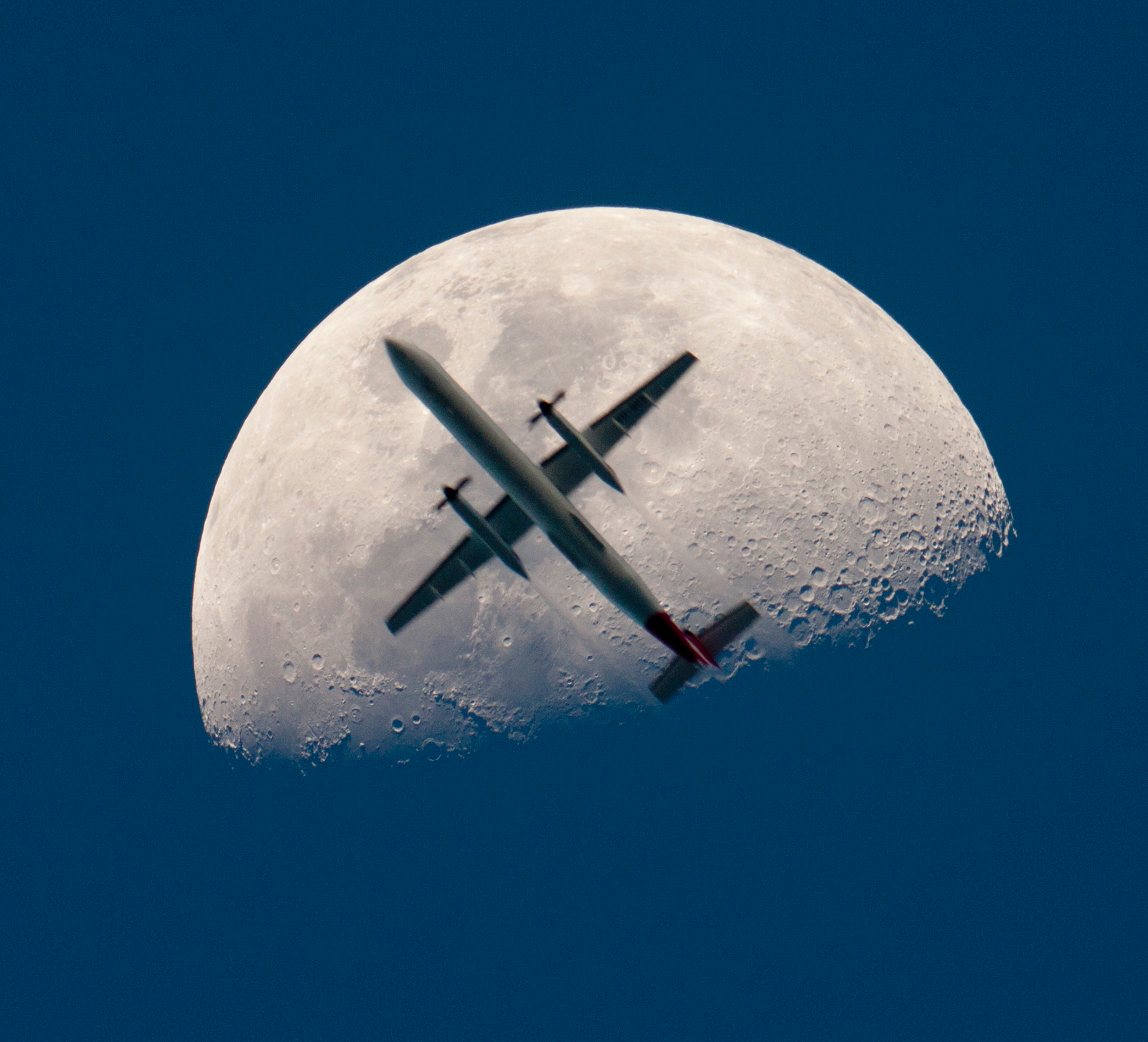 An Airplane in Front of the Moon