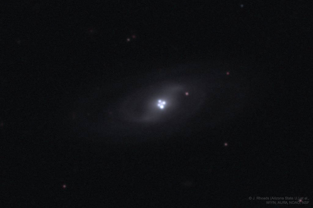 The Einstein Cross Gravitational Lens