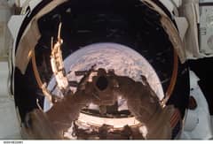 Preview of Orbiting Astronaut Reflects Earth