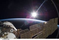 Preview of Bright Sun and Crescent Earth from the Space Station