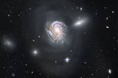 Preview of NGC 4911: Spiral Diving into a Dense Cluster