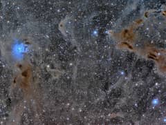 Preview of The Iris Nebula in a Field of Dust
