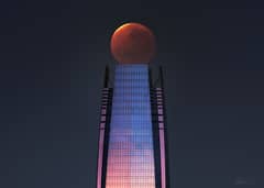 Preview of Lunar Eclipse over a Skyscraper
