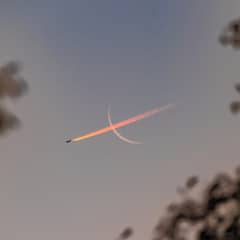 Preview of Plane Crossing Crescent Moon