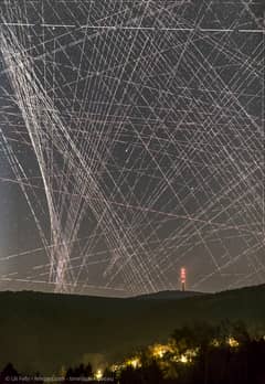 Preview of Comet R3 PanSTARRS Behind Satellite Trails