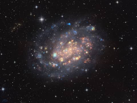 NGC 300: A Cosmic Gemstone with Stars and Gas Clouds