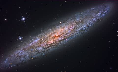 NGC 253: Dusty Island Universe