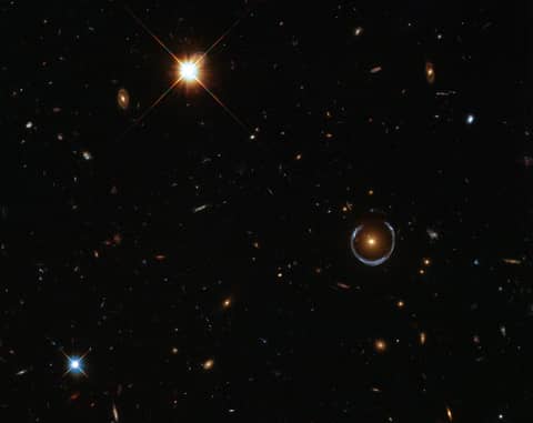 A Horseshoe Einstein Ring from Hubble