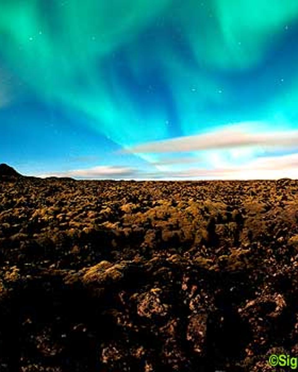 Aurora Over Clouds