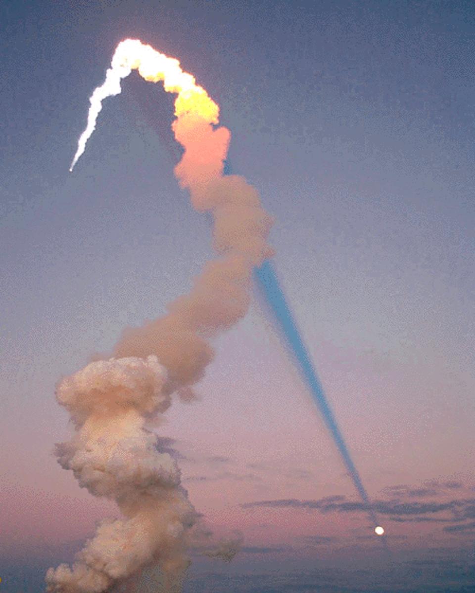 Shuttle Plume Shadow Points to Moon