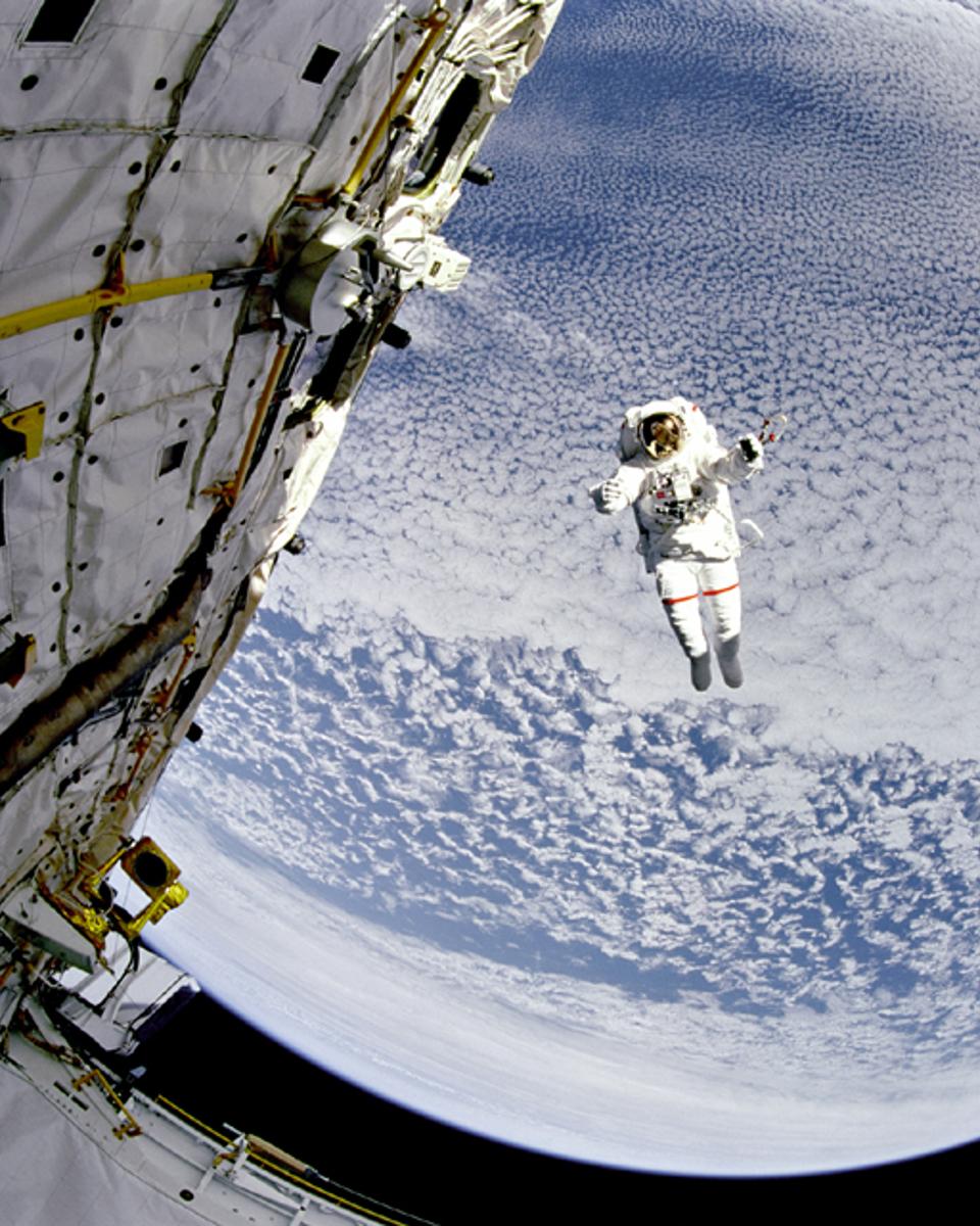 A Flying Astronaut Over Earth