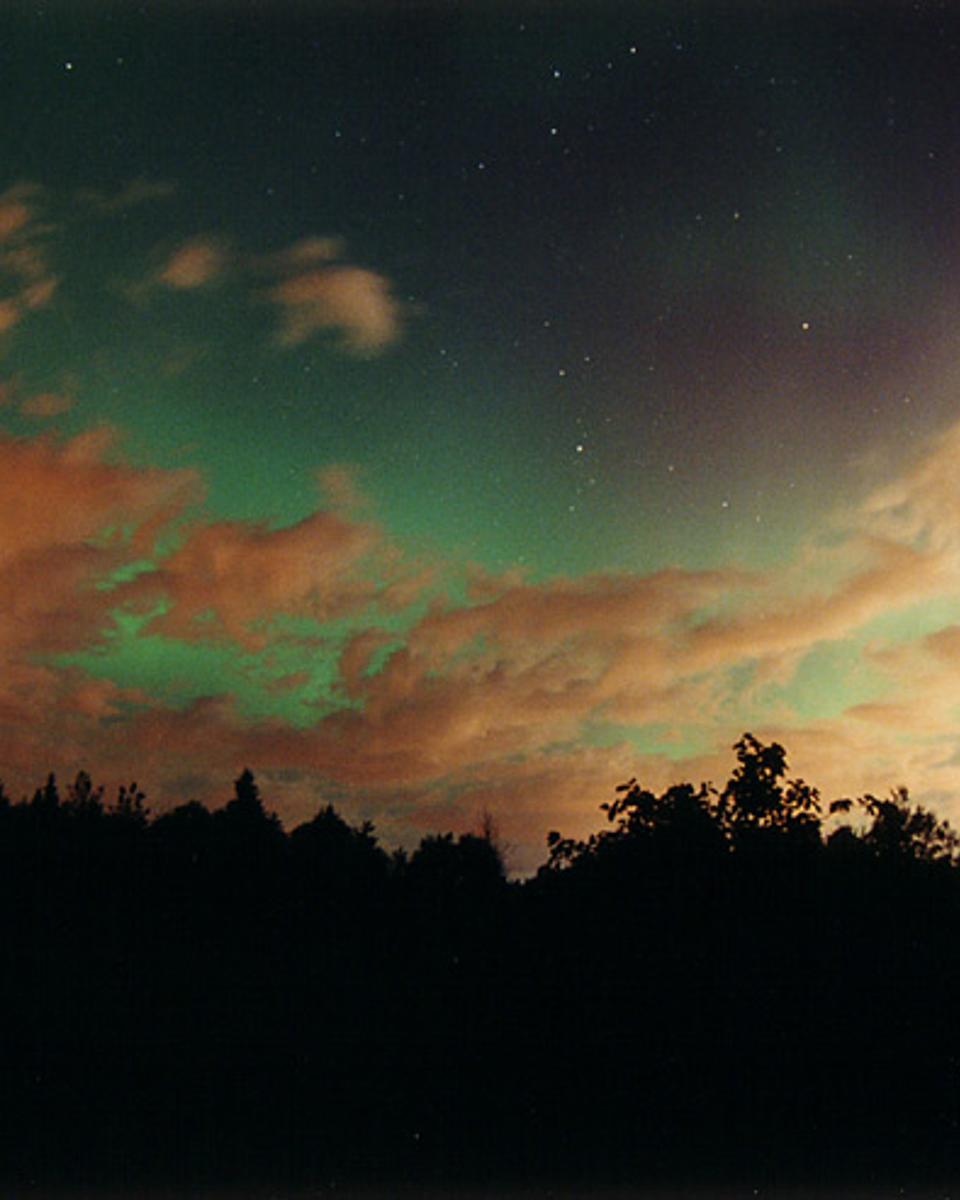 Aurora Over Clouds