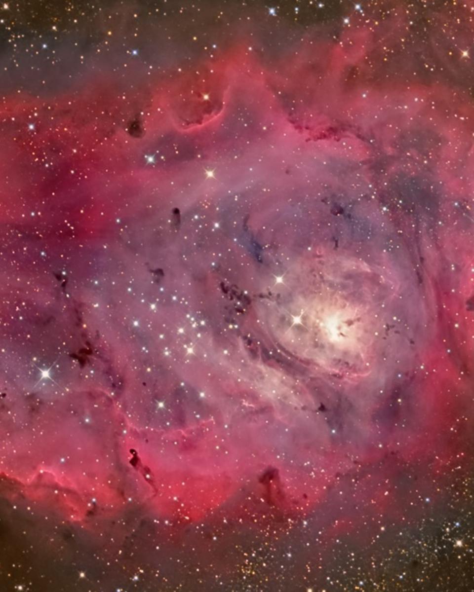 The Lagoon Nebula in Gas, Dust, and Stars