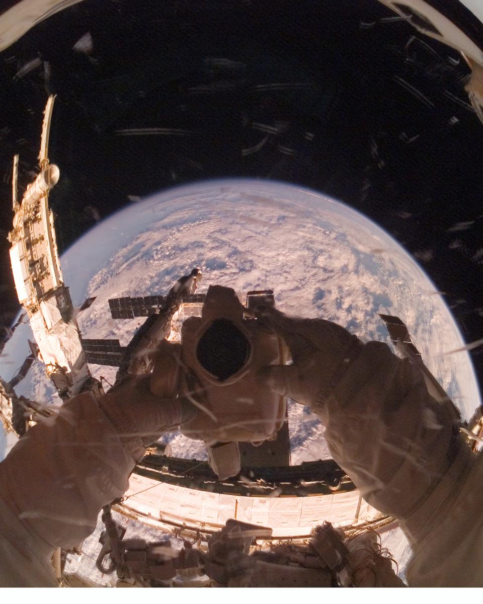 Orbiting Astronaut Reflects Earth