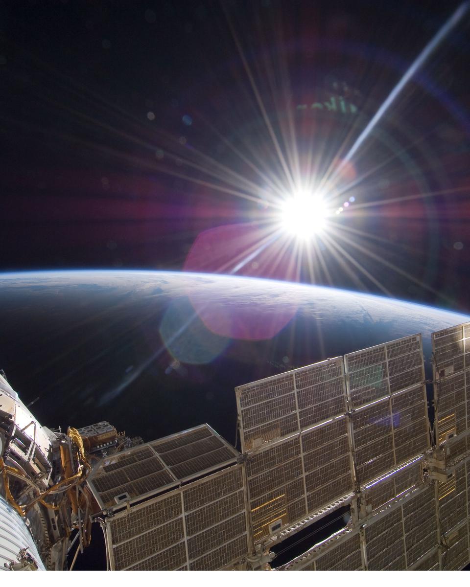 Bright Sun and Crescent Earth from the Space Station
