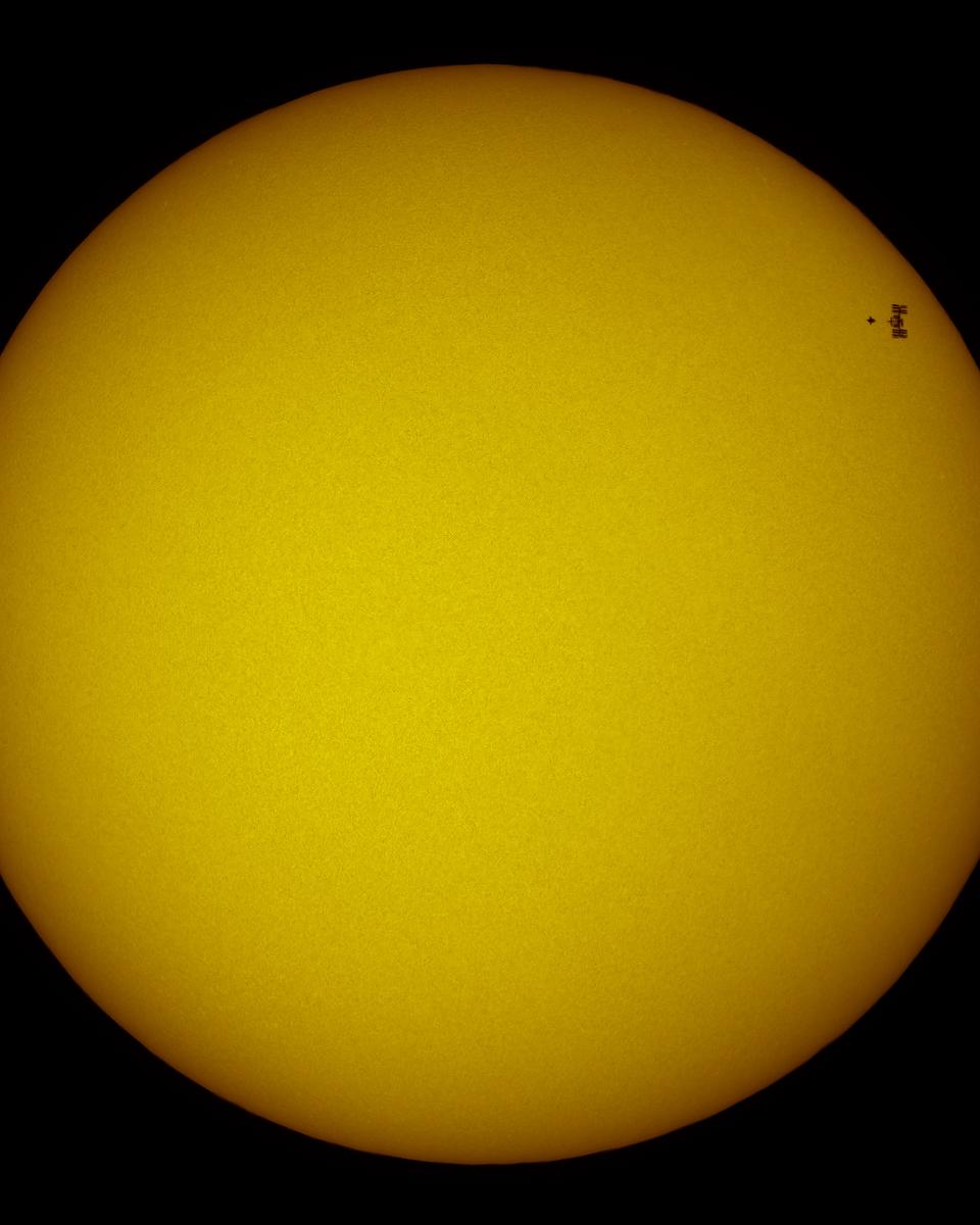 Station and Shuttle Transit the Sun