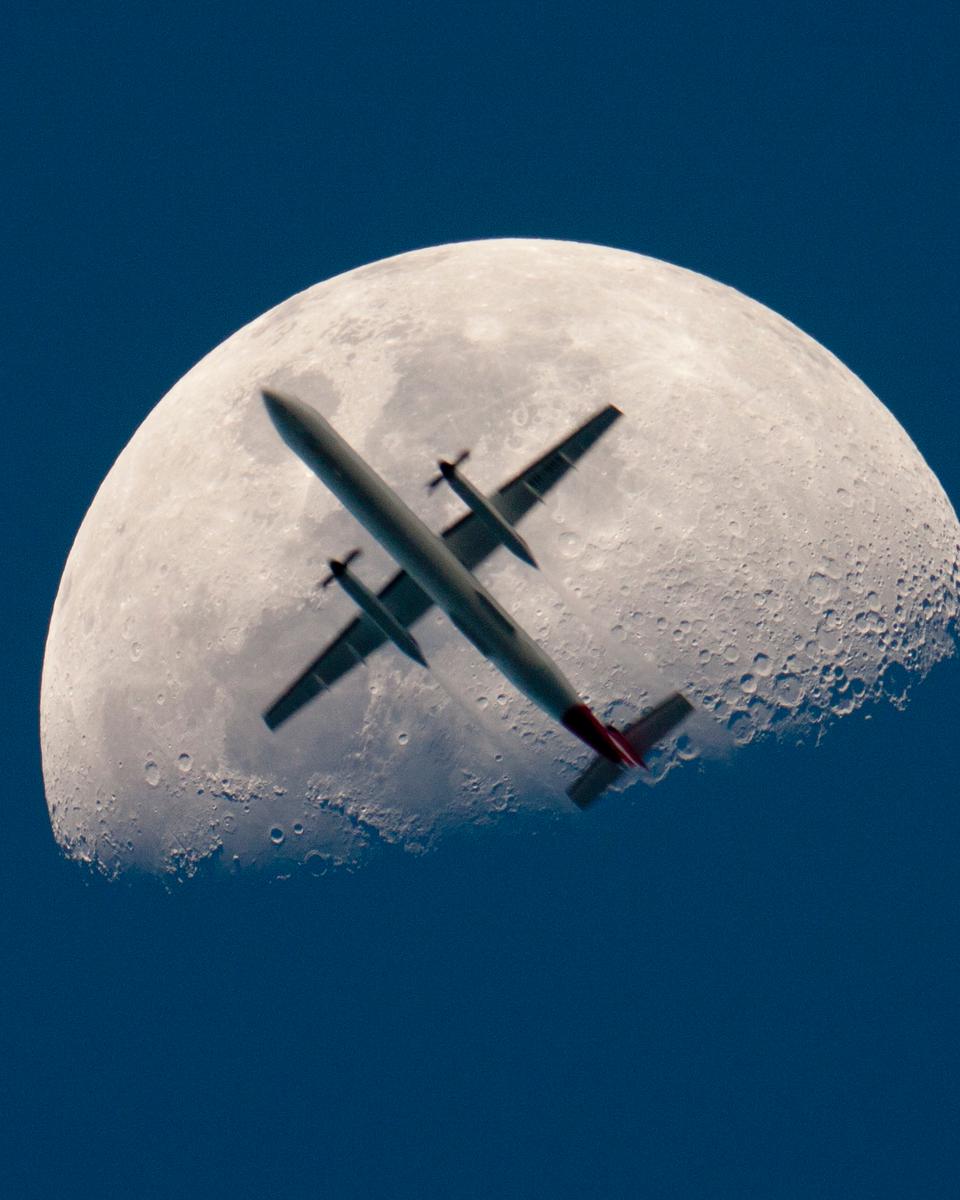 An Airplane in Front of the Moon