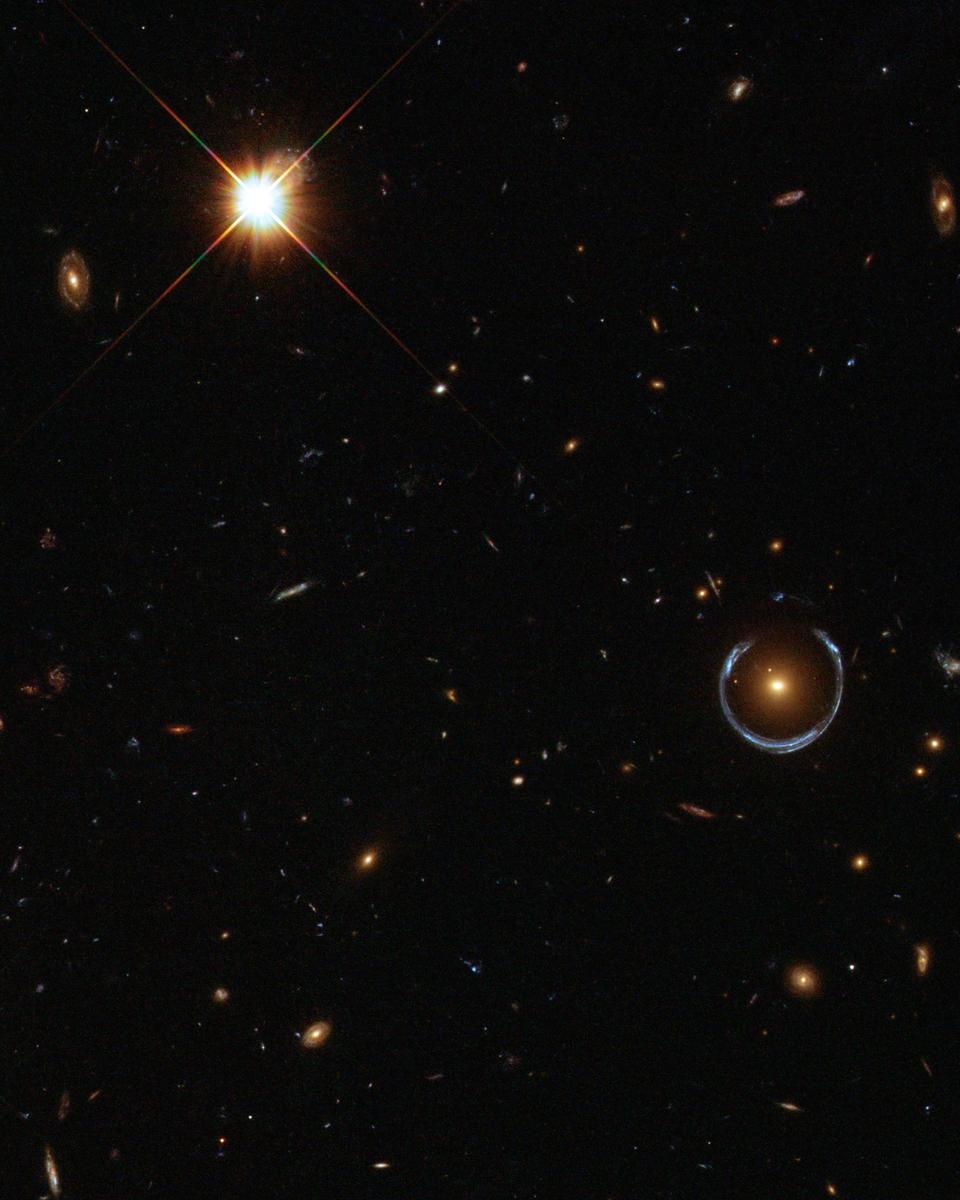 A Horseshoe Einstein Ring from Hubble