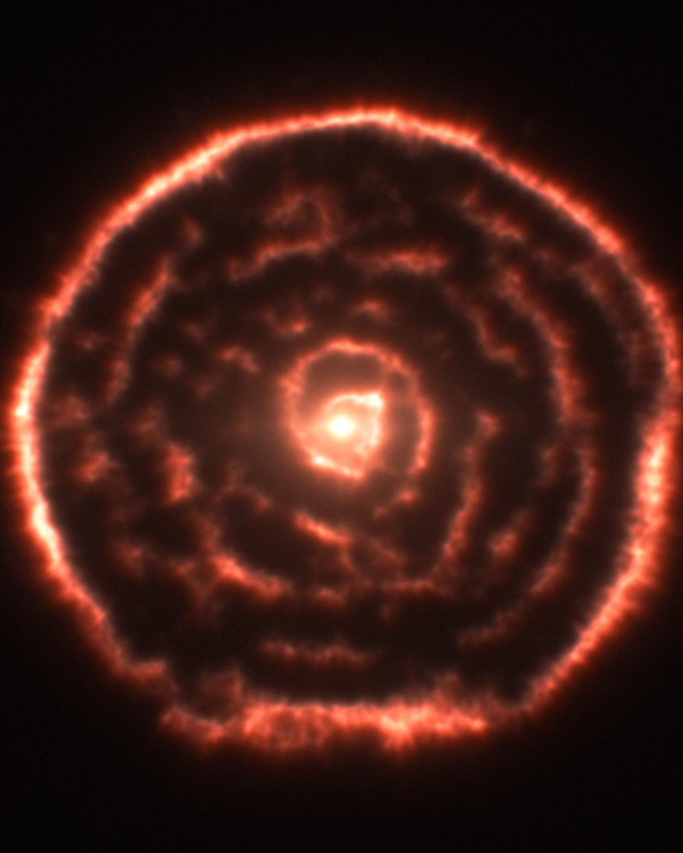 A Spiral Nebula Surrounding Star R Sculptoris