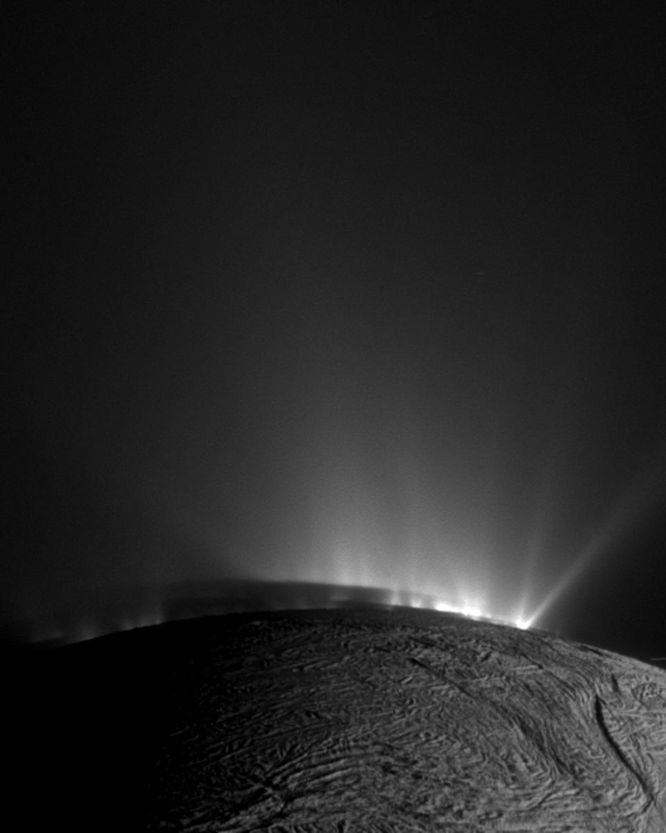 Shadows and Plumes Across Enceladus