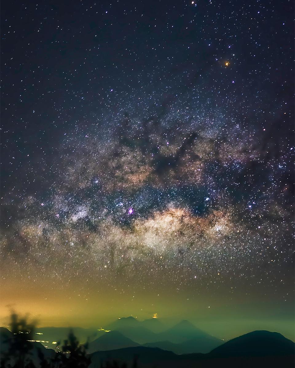 Milky Way over Erupting Volcano