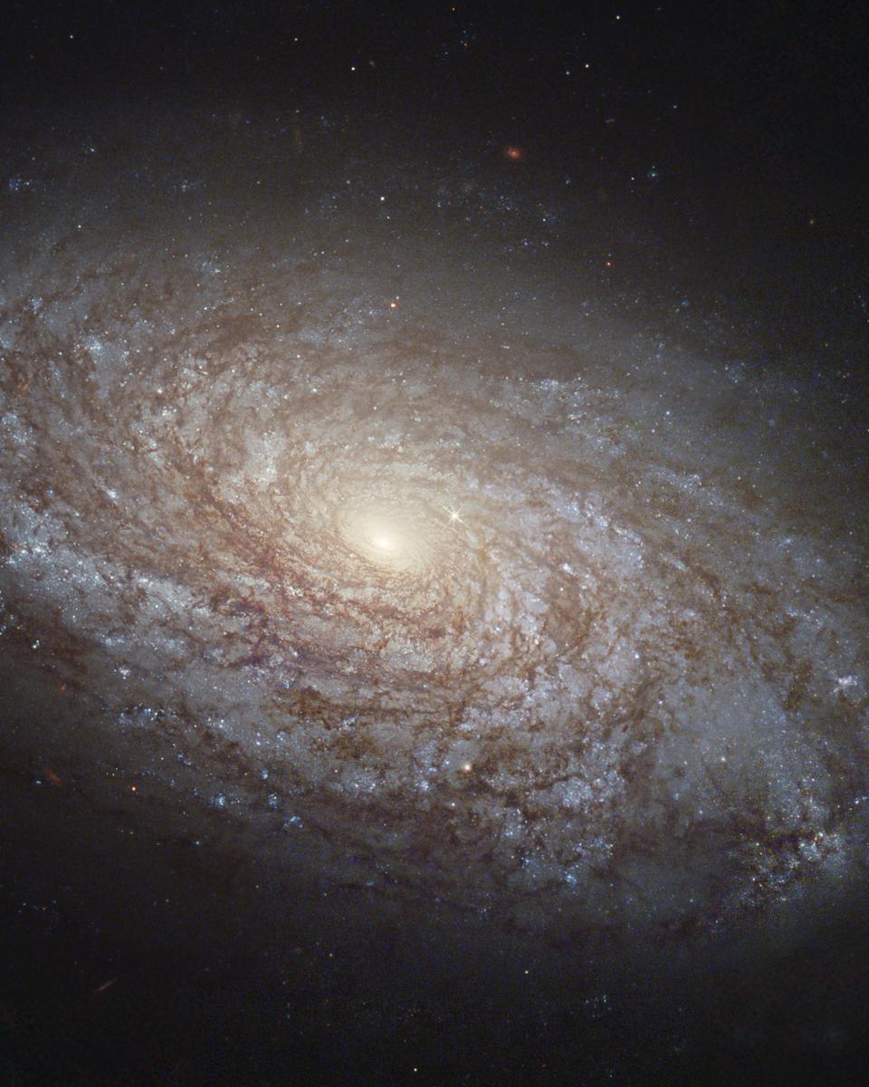 NGC 4414: A Flocculent Spiral Galaxy