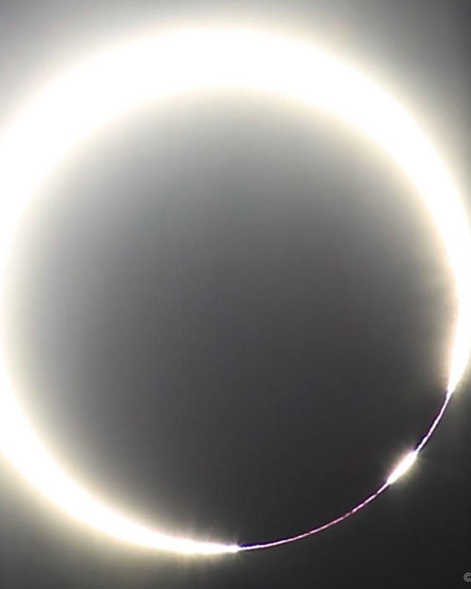 A Solar Eclipse with a Beaded Ring of Fire