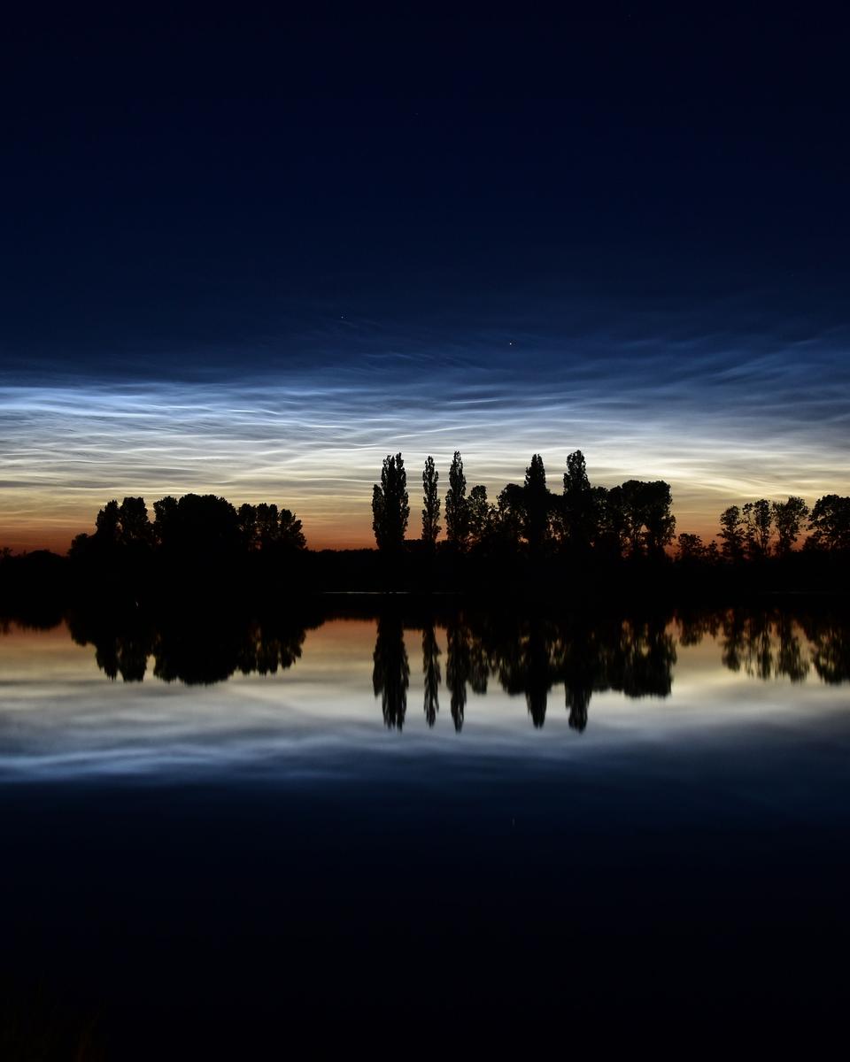 Noctilucent Clouds, Reflections, and Silhouettes