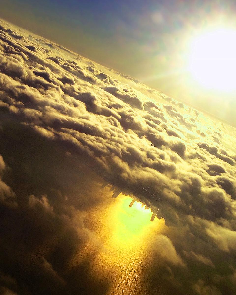 Inverted City Beneath Clouds