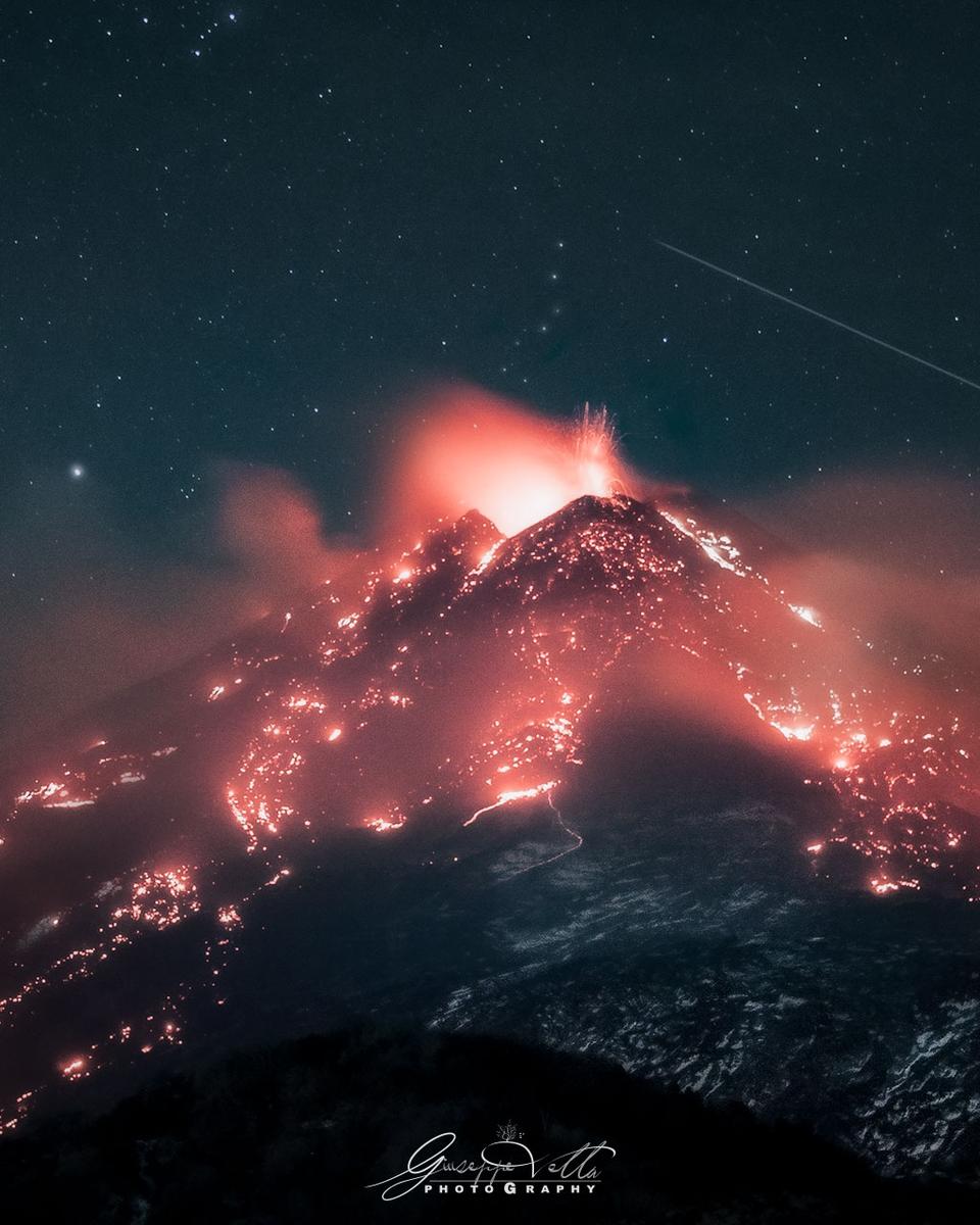 Stars over an Erupting Volcano
