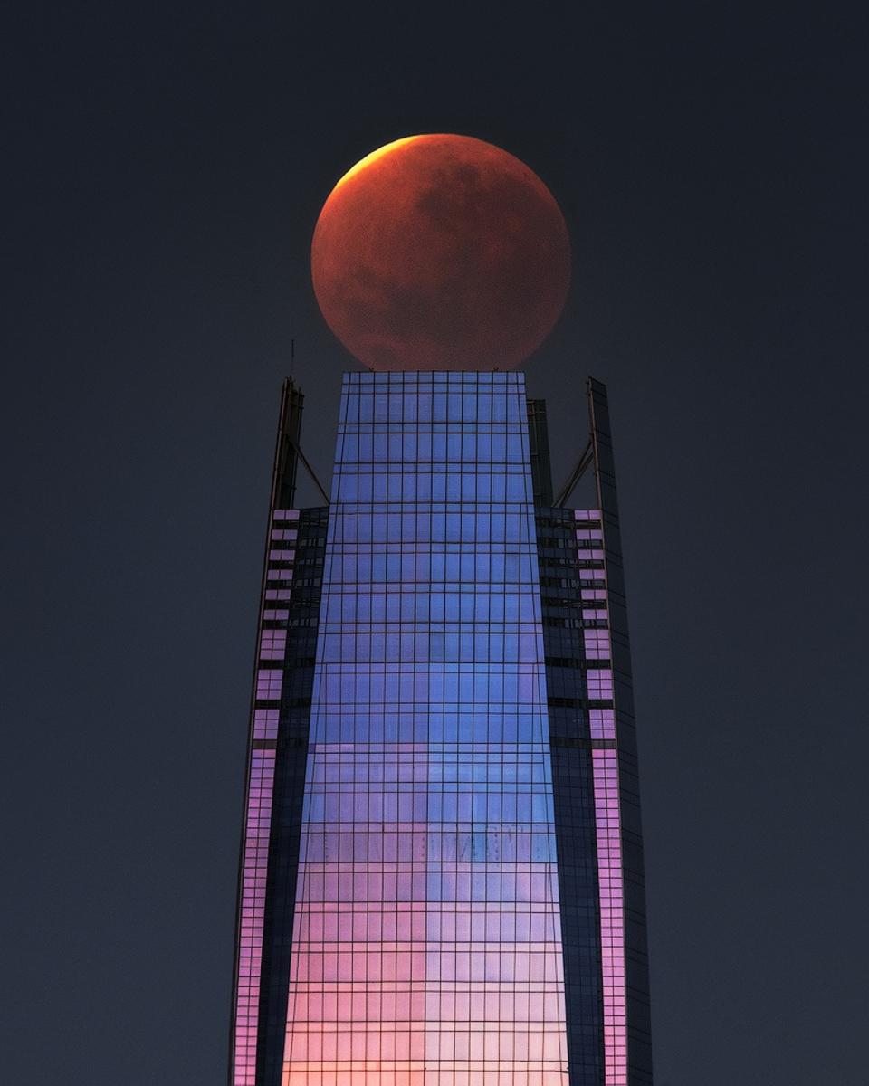 Lunar Eclipse over a Skyscraper