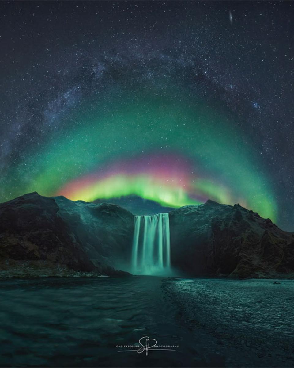 Rainbow Aurora over Icelandic Waterfall