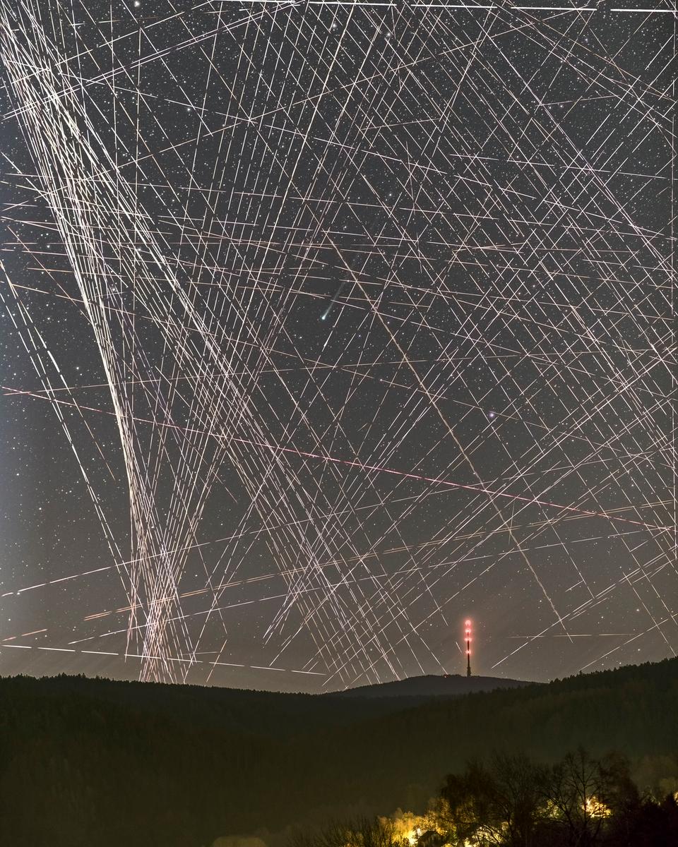 Comet R3 PanSTARRS Behind Satellite Trails
